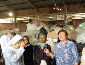Sisters visiting a recycling project begun by the Passo Fundo province to assist local women in earning money for their families by recycling castoffs. 